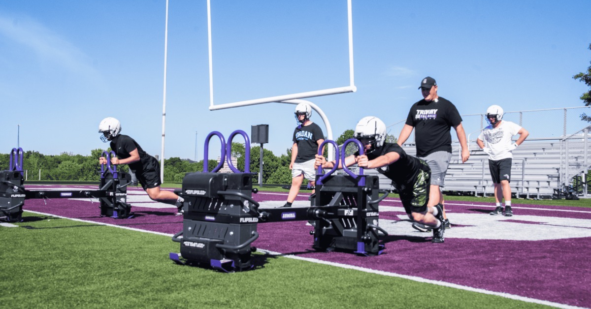 The Physics Behind Sled Training for Football Players