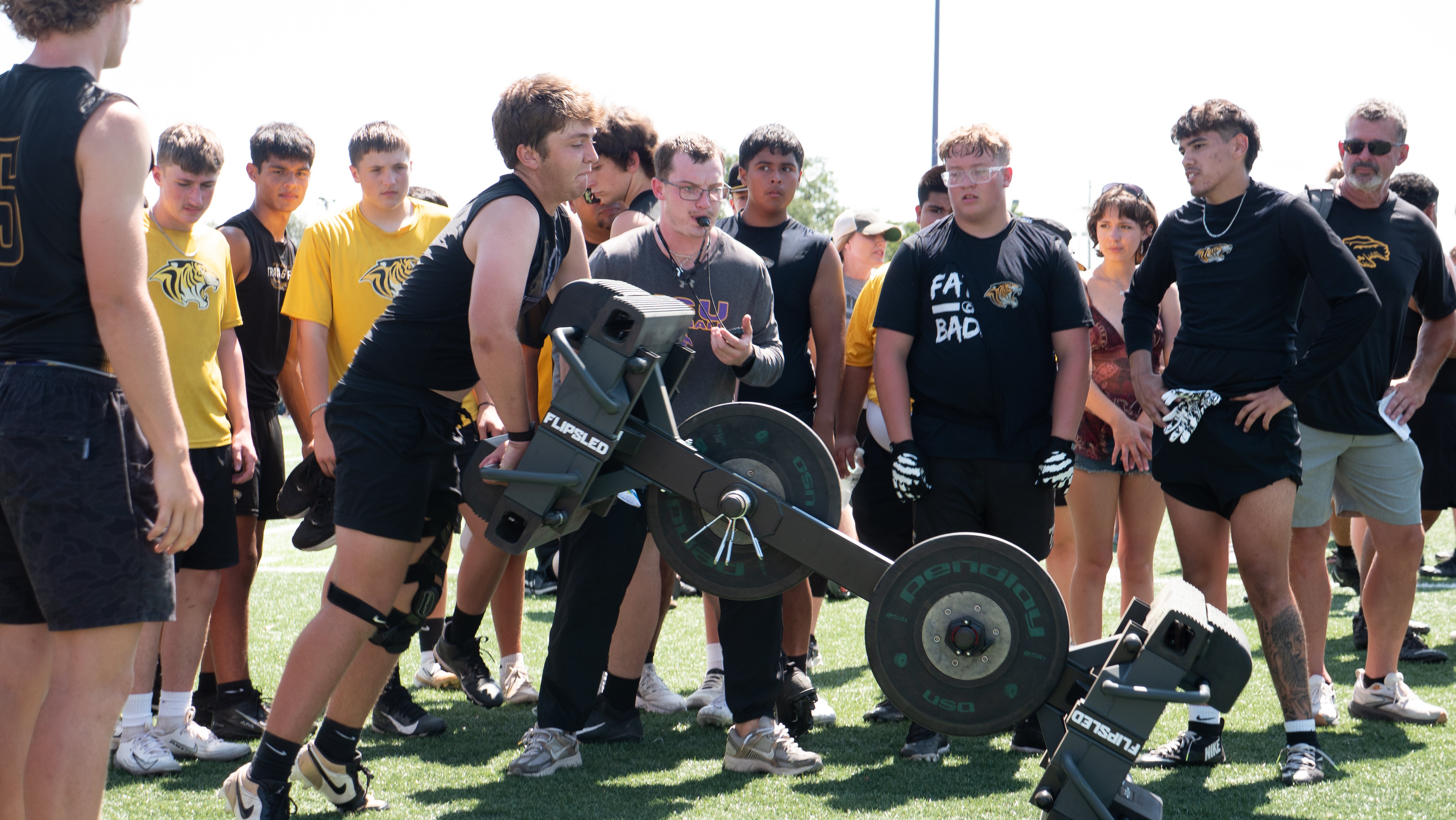 Football player flipping a multiplanar football sled