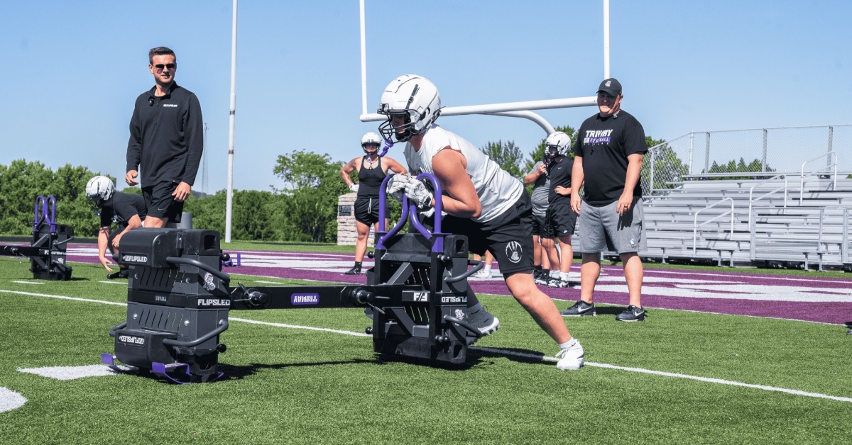 The Physics Behind Sled Training for Football Players